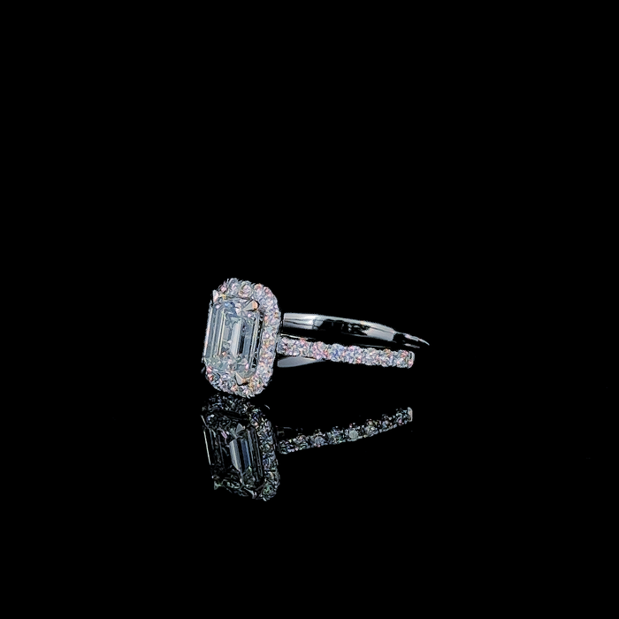 Emerald cut halo engagement ring, front-facing view of stone