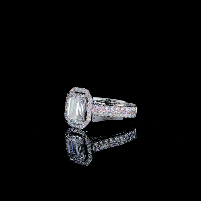 Emerald cut halo pave shank ring, front-facing view of stone