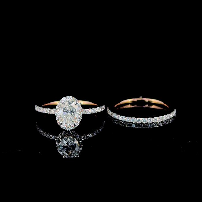 Oval halo bridal ring set, standing side angle