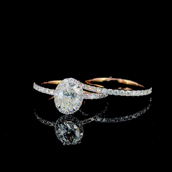 Oval halo engagement ring and pavé eternity band, shown as a set