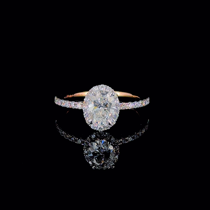 Oval halo pave shank ring, front-facing view of stone